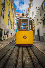 Fototapeta na wymiar Romantic yellow tramway - main symbol of Lisbon, Portugal