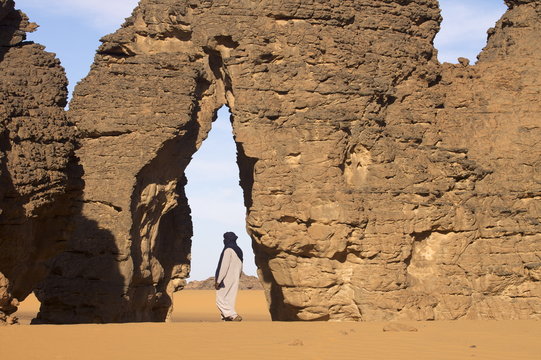 A Tuareg walking on the erg of Uan Kaza in the Fezzan desert, Libya