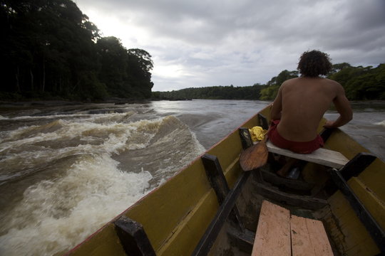 Pirogue in the rapids of the Approuague River, French Guiana