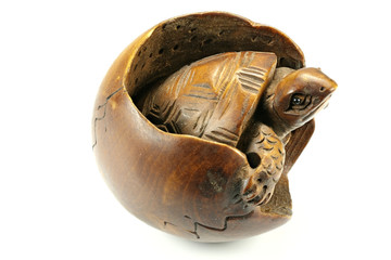 antique Japanese netsuke turtle made of boxwood isolated on white background