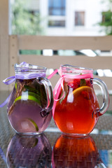 fresh Cocktail juice with mint and ice on table. Healthy organic drinks. Fresh mojito drink with ice and fruit
