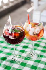 fresh Cocktail juice with mint and ice on table. Healthy organic drinks. Fresh mojito drink with ice and fruit