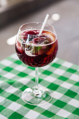 Beautiful festive cocktail with strawberries and ice in the glass