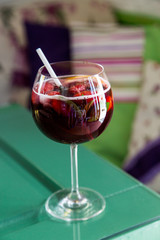 Beautiful festive cocktail with strawberries and ice in the glass