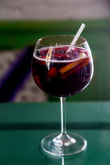 Beautiful festive cocktail with strawberries and ice in the glass