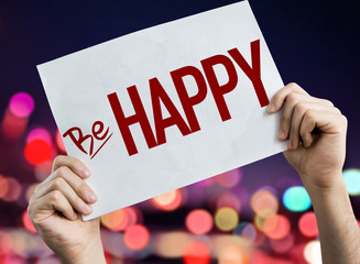 Be Happy placard with night lights on background