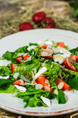 Beautiful fresh sweet salad with strawberries and mint leaves