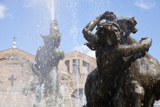 The Fountain of the Naiads in the Piazza della Repubblica and St. Mary of the Angels and of the Martyrs church and Diocletian Baths in the background, Rome, Lazio