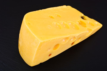 Swiss Cheese Isolated on Black Background