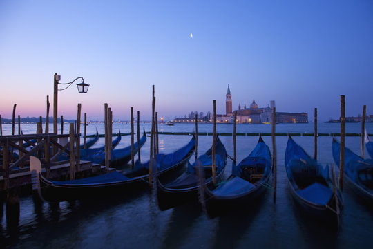 Daybreak view of gondolas from Piazzetta San Marco to Isole of San Giorgio Maggiore, Venice, Veneto