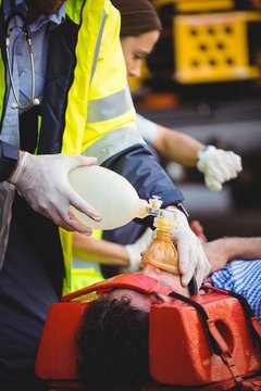 Ambulance man rescuing an injured man