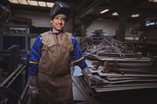 Portrait of smiling welder in workshop