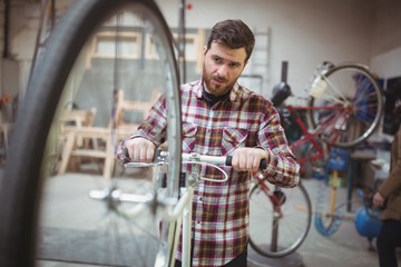 Mechanic repairing a bicycle