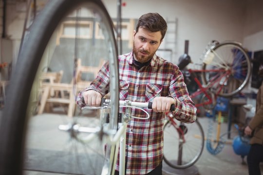 Mechanic repairing a bicycle