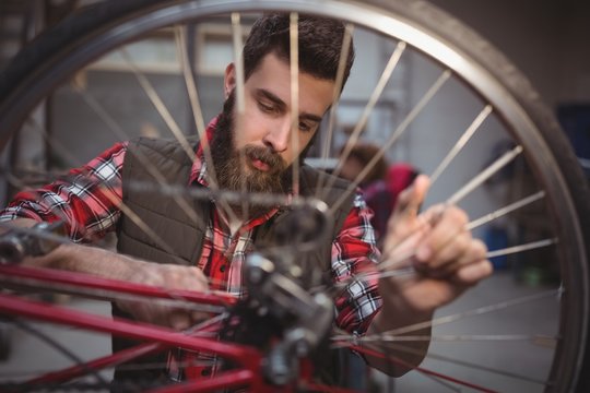 Mechanic repairing a bicycle