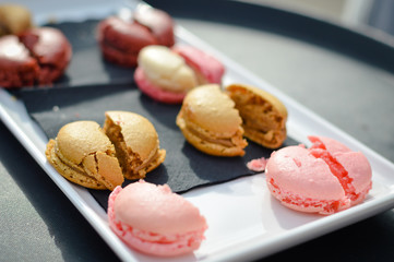 Colourful tasty macaroons in a row