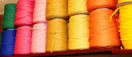 spools of thread and balls of wool for sale in the shop for tail