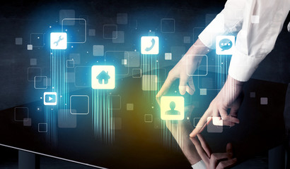 Modern smart table with high tech icons on its interface screen