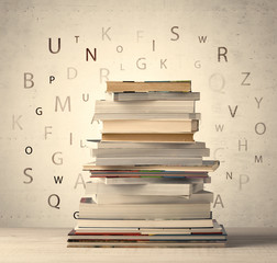 Books with flying letters on vintage background