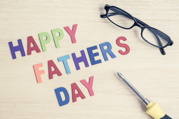 Happy Father's Day - colorful wording with glasses and screwdriv