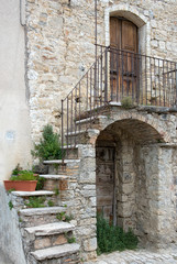 Fototapeta na wymiar Picturesque facade of an old stone house