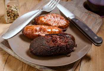 sausage and white sausage baked in earthenware