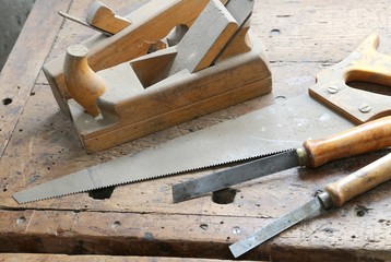 planes and chisels and a saw on the Workbench inside the craftsm