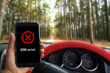 "SIM Error" showing on the smartphone inside of a pickup truck.