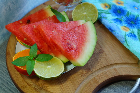 Watermelon. Fresh and juicy watermelon sliced on a white plate - selective focus
