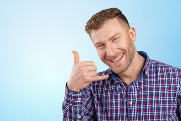 young  man showing call me