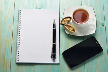 Coffee break. Coffee cup with note book