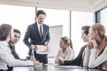 Business people discussing charts