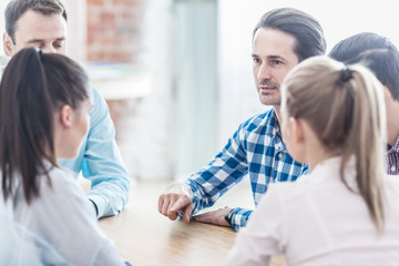 Business team talking at meeting table