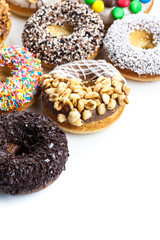 various donuts on white background
