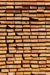 Stacked of wood log for construction buildings background and texture