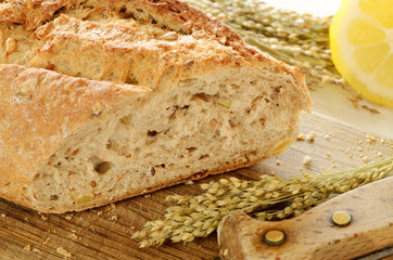 Close-up of fresh wheat bread  on wooden cutting board