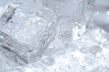 Naklejka na ściany i meble Macro detail of ice cubes with water droplet