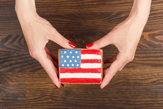 Cookie with American patriotic colors in the hands