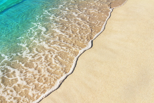 Soft ocean wave on the sandy beach