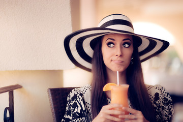 Surprised Woman With Orange Juice in a Restaurant