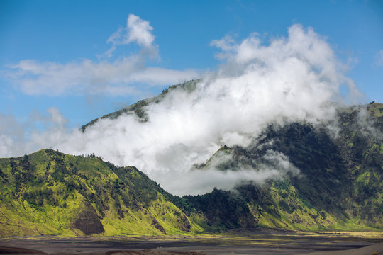 Clouds on the ridge of Mount Bromo volcano caldera, Indonesia