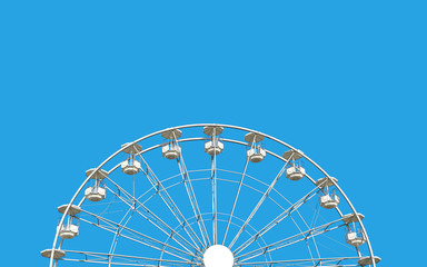 Ferris wheel against blue sky.