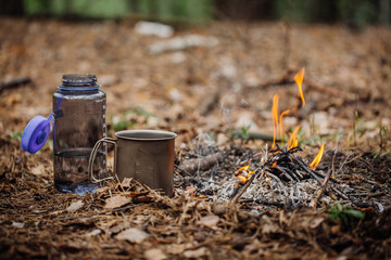 Obraz premium grilled rabbit meat on wooden board, with knife, water bottle an