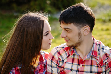 Fototapeta premium Portrait of a happy couple looking to each other close up
