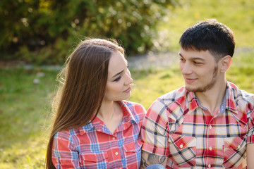 Portrait of a happy couple looking to each other close up