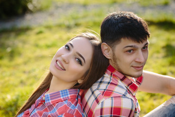 Fototapeta premium Portrait of a happy couple grass background close up
