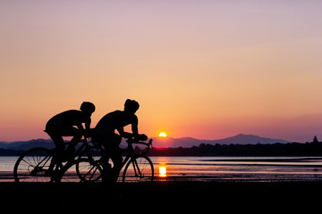 Fototapeta na wymiar Triathlon sport at beach on sunset time