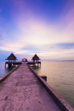 Walking path leading to the sea with twilight sky background