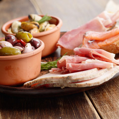 Tapas of salmon, mussels, jamon and olives