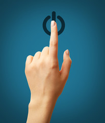 Finger press power button on virtual touch screen, modern technology concept